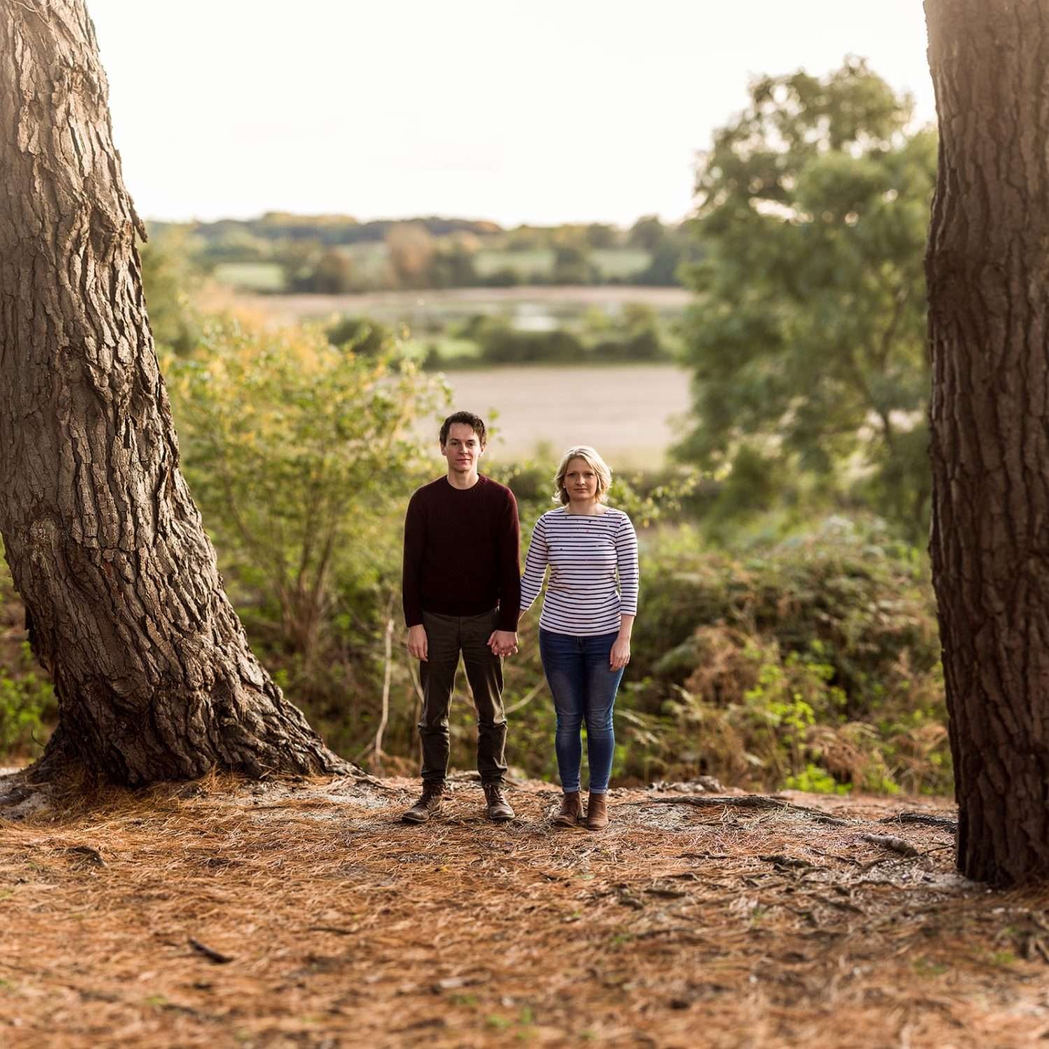 an engaged couple demonstrate What to wear to your engagement shoot at woodbridge in suffolk 