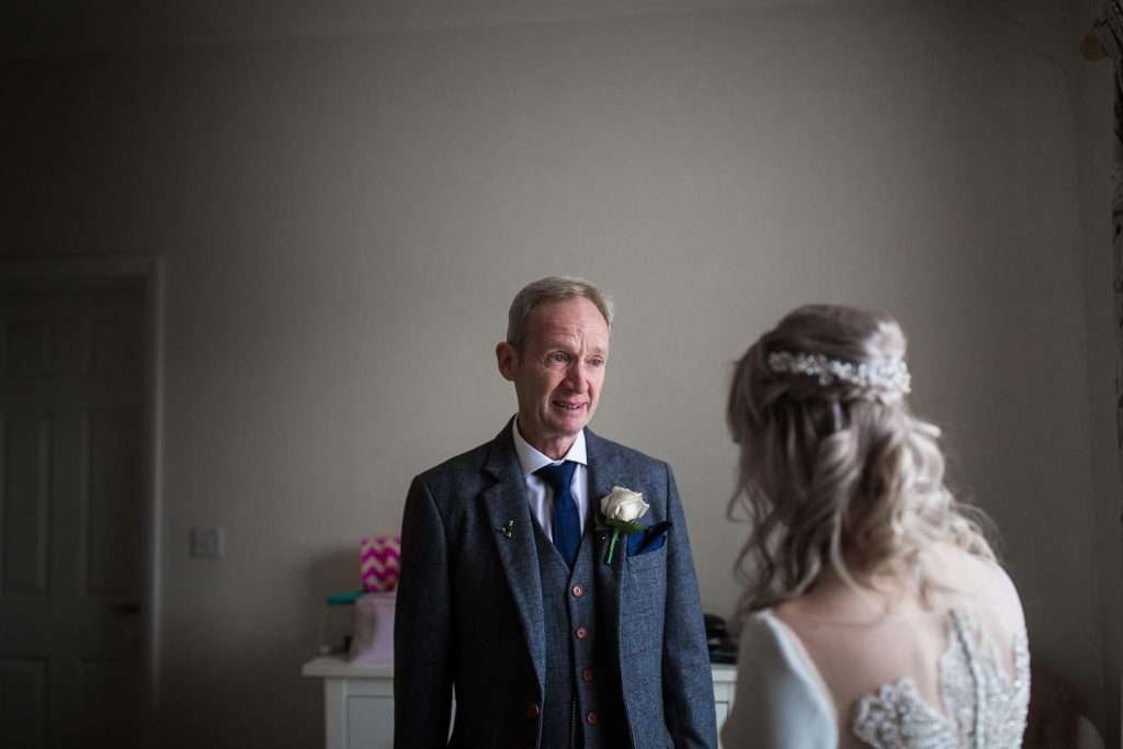 dad sees his daughter for the first time at her henham park wedding in suffolk 