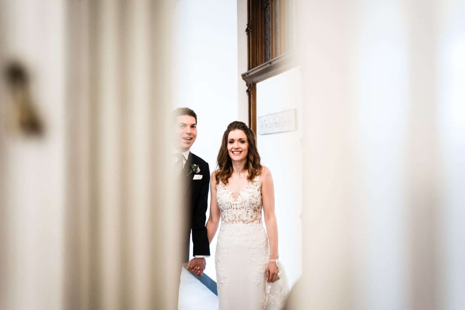 bride and groom wait to enter the dining room for their wedding breakfast
