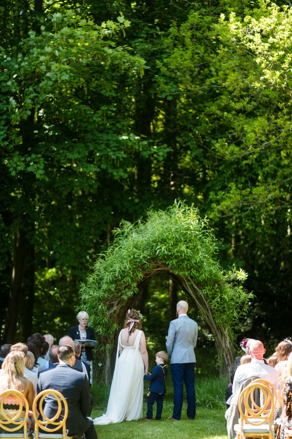 Couple ceremony shot at a Chaucer Barn wedding in Norfolk in the woodland area