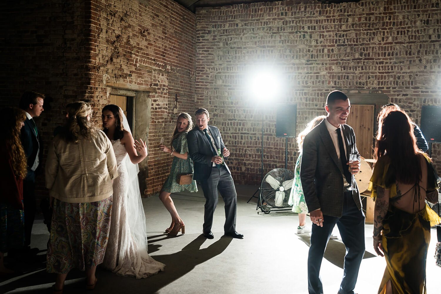 guests enjoy the after dinner festivities at a fishley hall wedding in norfolk