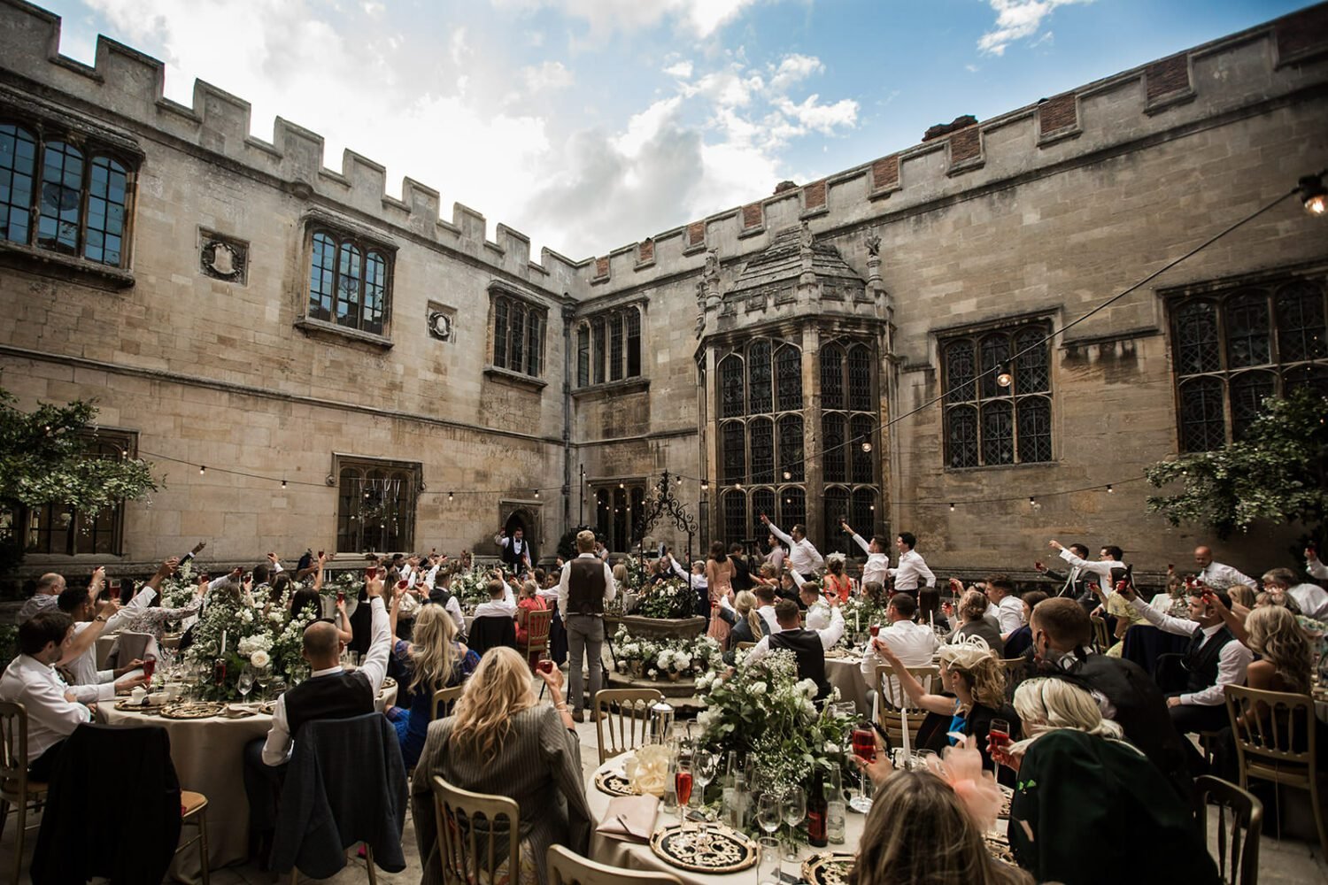 wedding breakfast in the courtyard at hengrave hall 