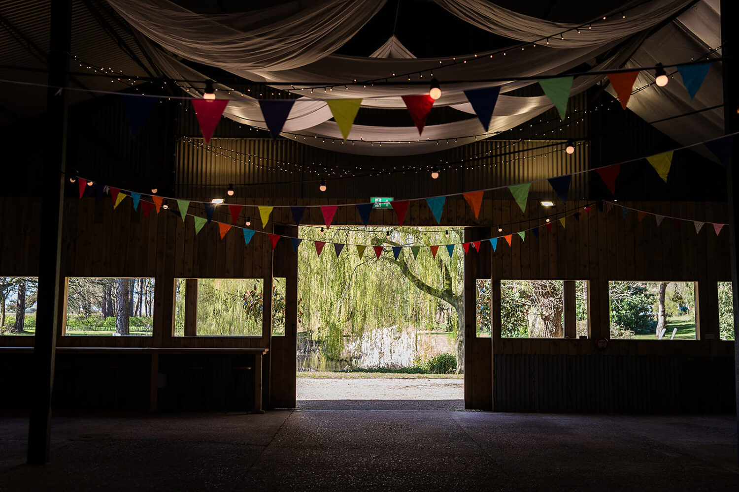 the dutch barn dining space at happy valley wedding venue in norfolk