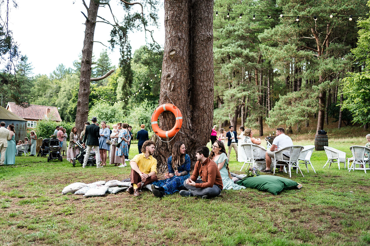 guests chilling post ceremony at happy valley near Grimston in Norfolk by www.lisaandneil.co.uk