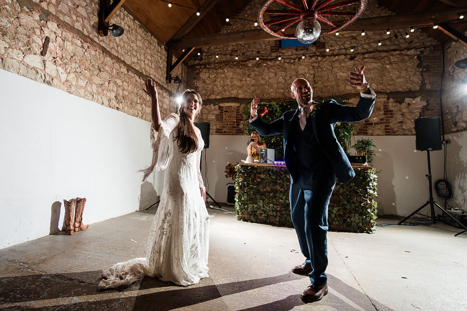 couple cutting their wedding cake at happy valley in the hay barn